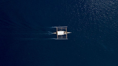 High angle view of sea against clear sky at night