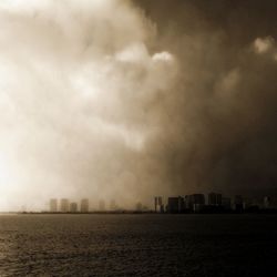 View of city against cloudy sky