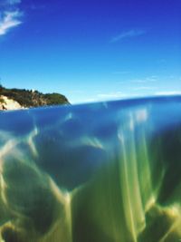 Scenic view of sea against blue sky