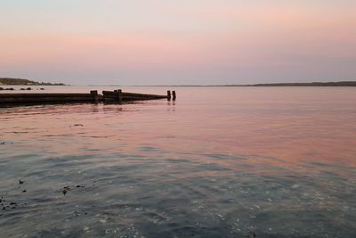 Scenic view of sea against sky at sunset