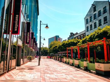Street amidst buildings against sky
