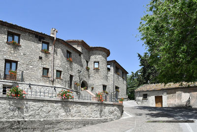 A narrow street between the old houses of marsicovetere, a village  of potenza province, italy.