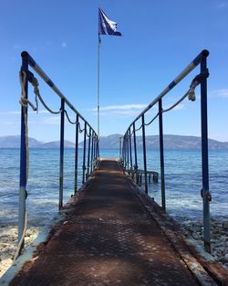 Pier over sea against sky