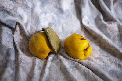 Close-up of yellow fruits on bed