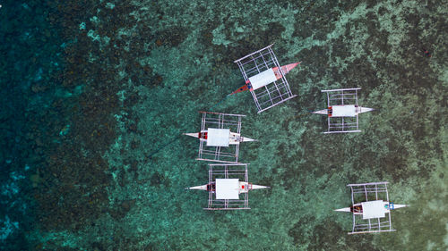 High angle view of trees by sea