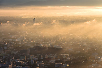 High angle view of cityscape during foggy weather