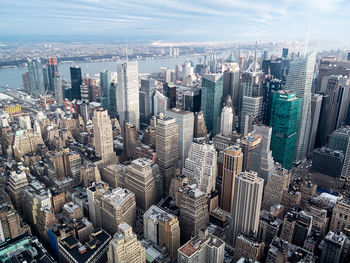 High angle view of modern buildings against sky in city