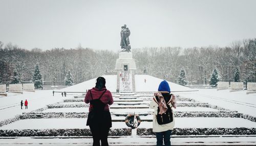 Rear view of women at treptower park during winter