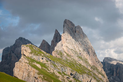 Low angle view of rock formation against sky