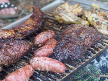 Close-up of meat on barbecue grill