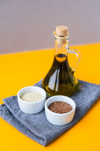 Sesame and flax seeds with oil in glass bottle. healthy food concept. vegan keto diet. healthy 