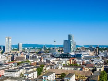 Cityscape against clear blue sky