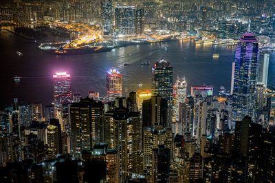 Aerial view of city lit up at night