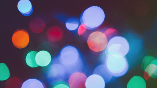 Defocused image of illuminated lights at night