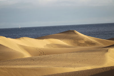 Scenic view of desert against sky