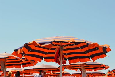 Umbrellas against clear sky