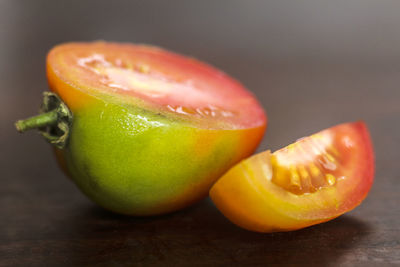 Close-up of sliced tomatoes on wooden table