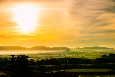 Scenic view of landscape against sky during sunset