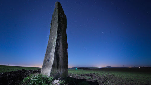 Scenic view of landscape against clear sky at night