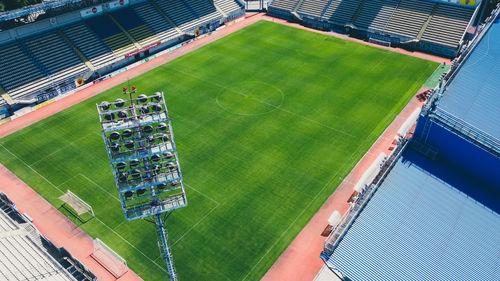 Aerial view of empty football field arena in the day. football stadium with green grass.