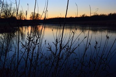 Scenic view of lake against sky during sunset