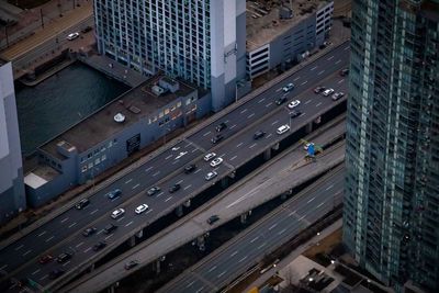High angle view of traffic on road amidst buildings