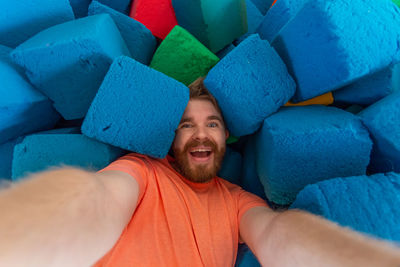 Portrait of a smiling young man lying down