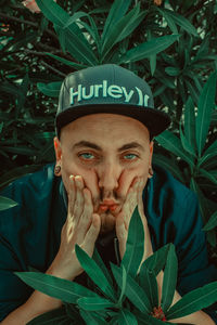 Portrait of man with plants