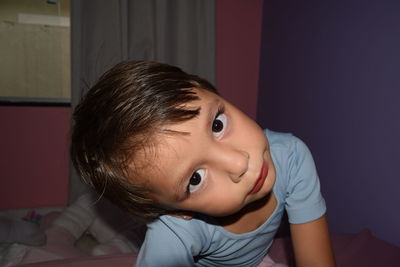 Close-up portrait of cute girl with make-up at home
