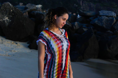 Full length of woman standing on rock