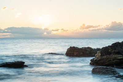 Scenic view of sea against sky during sunset