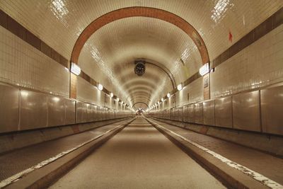 Illuminated tunnel at subway station