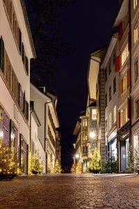 Low angle view of illuminated buildings at night