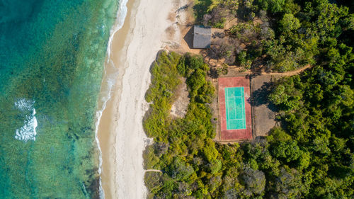 Aerial view of the tennis court next to the ocean in dar es salaam