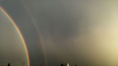 Low angle view of rainbow against sky