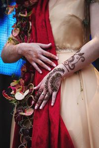 Close-up of woman wearing henna tattoo