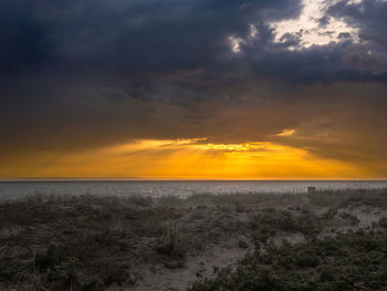 Scenic view of sea against sky during sunset