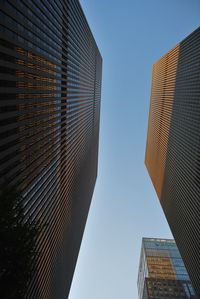 Low angle view of skyscraper against clear sky