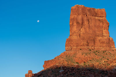Landscape of red buttes against blue sky in the valley of the gods in utah
