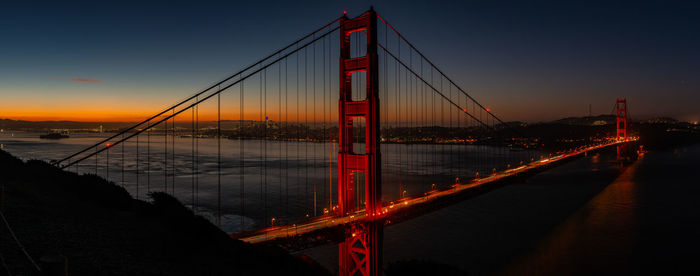 Golden gate bridge over river at dusk