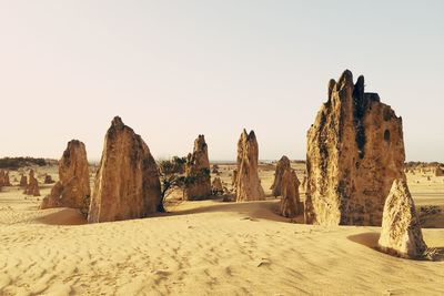 Panoramic view of desert against clear sky