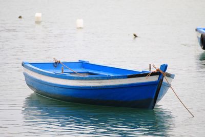 Boat moored in sea