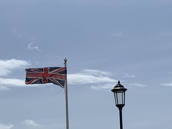 Low angle view of street light against sky