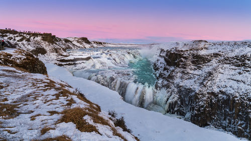 Scenic view of frozen sea against sky during sunset