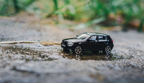 Close-up of toy car on road