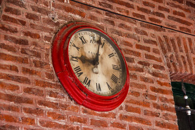 Low angle view of wall clock