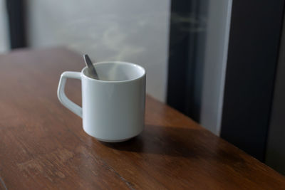 Close-up of coffee cup on table