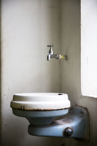 Close-up of faucet in bathroom