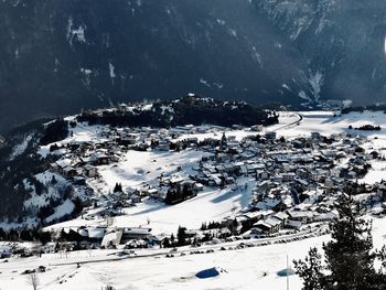 Snow covered landscape against sky
