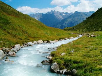 Scenic view of river flowing through rocks